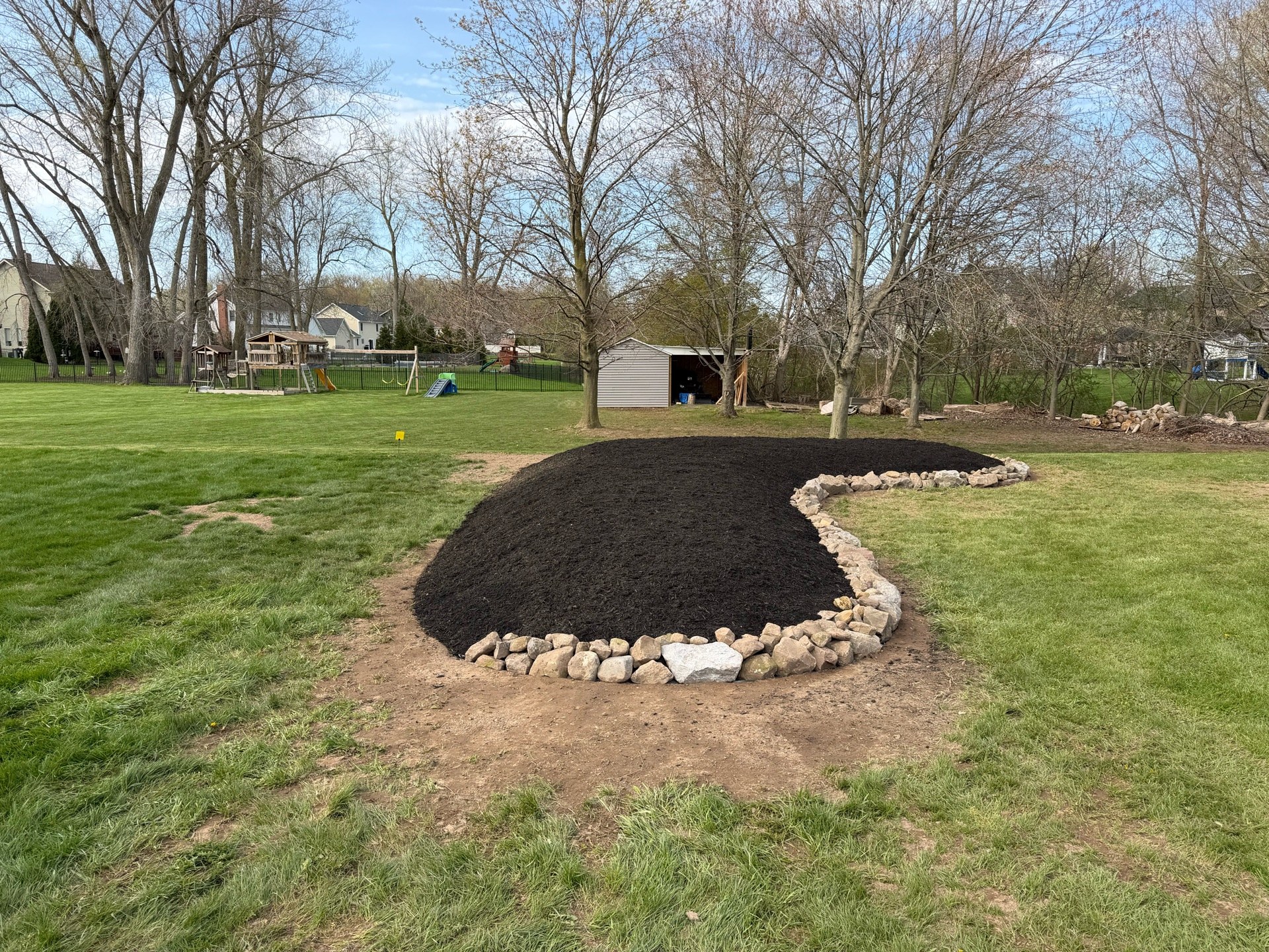 The rock ring reset and fresh mulch down
