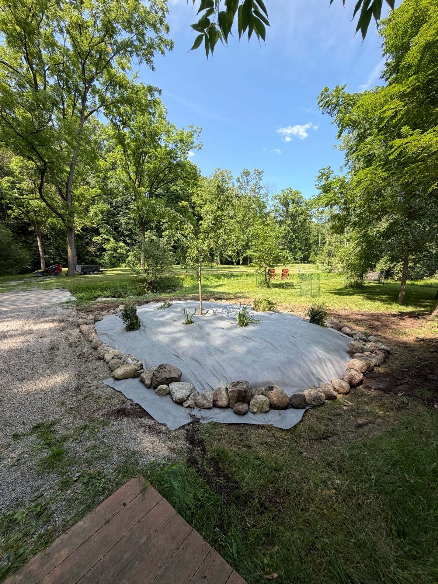 Boulders moved back into place with a small machine